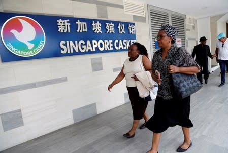 Visitors arrive at funeral parlour Singapore Casket, where the body of late former Zimbabwe's President Robert Mugabe is being held in Singapore