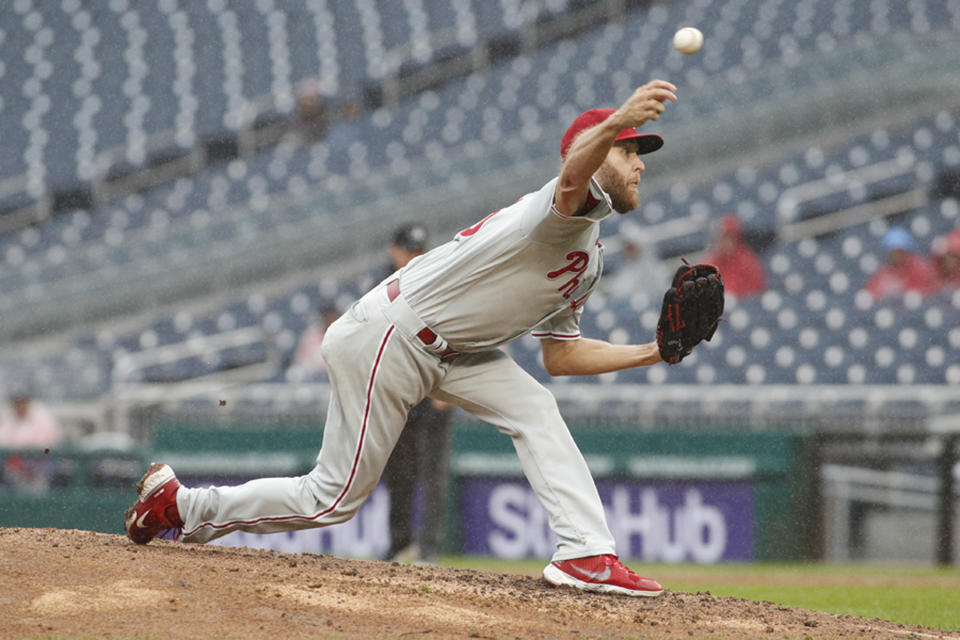 Philadelphia Phillies starting pitcher Zack Wheeler throws the ball to a Washington Nationals player during the fourth inning of a baseball game, Sunday, Oct. 2, 2022, in Washington. (AP Photo/Luis M. Alvarez)