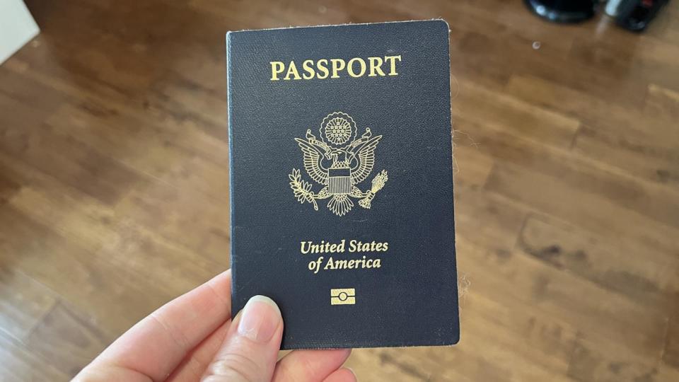 PHOTO: A person holds a United States passport with Department of State logo visible, Lafayette, CA, May 23, 2023.  (Smith Collection/Gado via Getty Images)