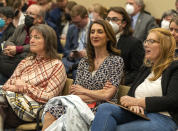 Nichole Mason, center, president of Utah Parents United, listens to a Utah Legislative committee hearing on Jan. 27, 2022 in Salt Lake City. Several years of pandemic restrictions and curriculum battles have emboldened longtime advocates of funneling public funds to private and religious schools in statehouses throughout the country. (Rick Egan/The Salt Lake Tribune via AP)