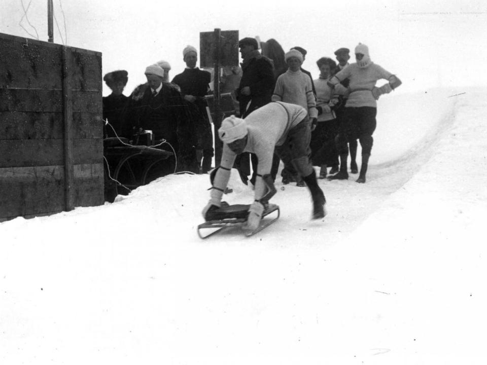 A skeleton competitor taking off in his toboggan at the Cresta Run, St Moritz, Switzerland, in January 1908 (Topical Press Agency/Getty)