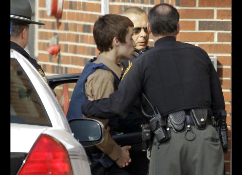 T.J. Lane, a suspect in Monday's shooting of five students at Chardon High School is taken into juvenile court by Geauga County deputies in Chardon, Ohio on Feb. 28, 2012. Three of the five students wounded in the attacks have since died. 