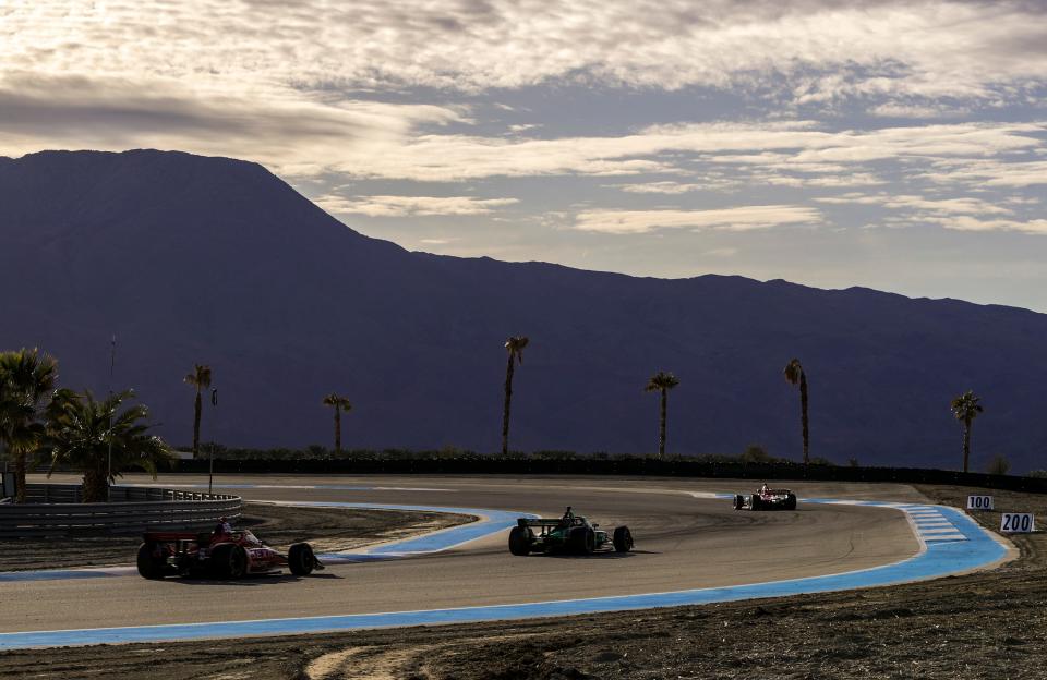 Simon Pagenaud of Meyer Shank Racing (front), Agustin Canapino of Juncos Hollinger Racing and Benjamin Pedersen of A.J. Foyt Enterprises head into turn 14 after the afternoon session resumes from a red flag during day two of NTT IndyCar Series open testing at The Thermal Club in Thermal, Calif., Friday, Feb. 3, 2023.