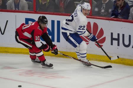 Mar 30, 2019; Ottawa, Ontario, CAN; Ottawa Senators left wing Anthony Duclair (10) and Toronto Maple Leafs defenseman Nikita Zaitsev (22) chase the puck in the third period at the Canadian Tire Centre. Mandatory Credit: Marc DesRosiers-USA TODAY Sports