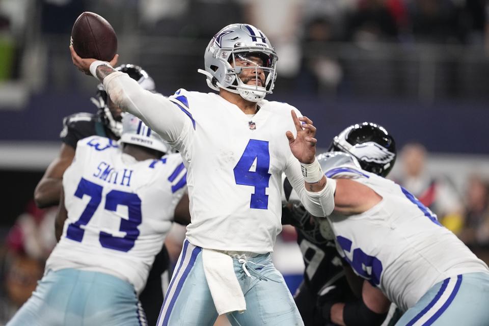 Dallas Cowboys' Dak Prescott thorws during the second half of an NFL football game against the Philadelphia Eagles Saturday, Dec. 24, 2022, in Arlington, Texas. (AP Photo/Tony Gutierrez)