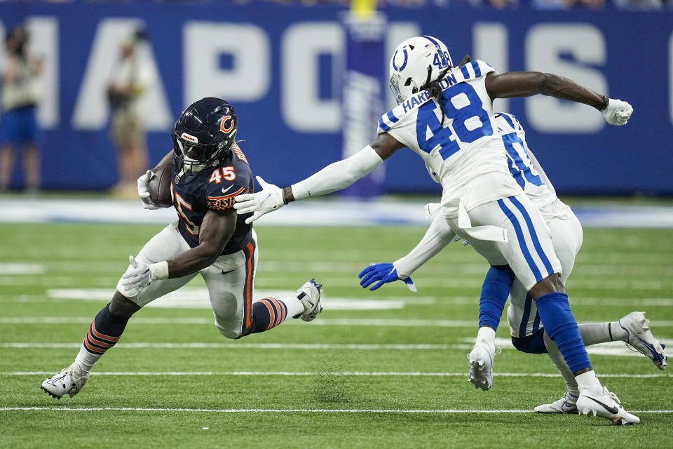 Chicago Bears fullback Robert Burns (45) runs around Indianapolis Colts safety Ronnie Harrison Jr. (48) during the second half of an NFL preseason football game in Indianapolis, Saturday, Aug. 19, 2023. (AP Photo/Darron Cummings) ORG XMIT: INAM121