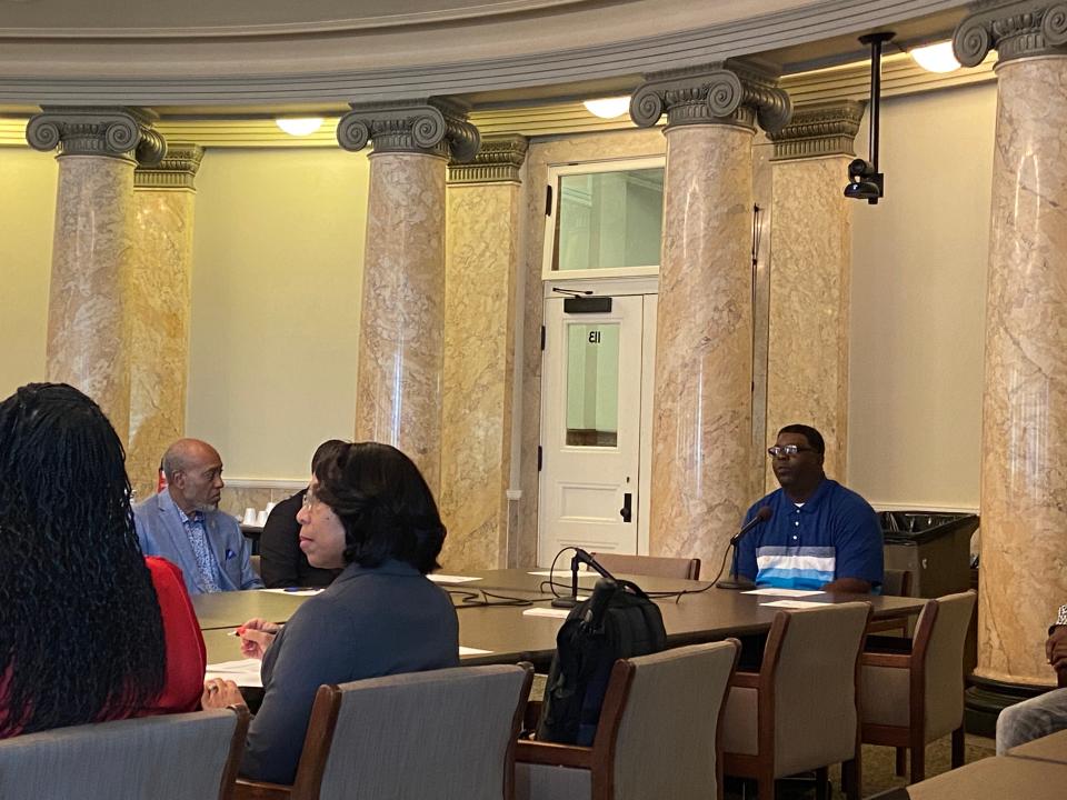 Kenneth Almons, right, speaks to lawmakers about his time in the state prison system and losing his right to vote Wednesday at the Mississippi State Capitol at 400 High St. Almons was one of several people previously convicted of disenfranchising felonies who spoke to lawmakers about why legislation to give some of them back the right to vote is necessary.