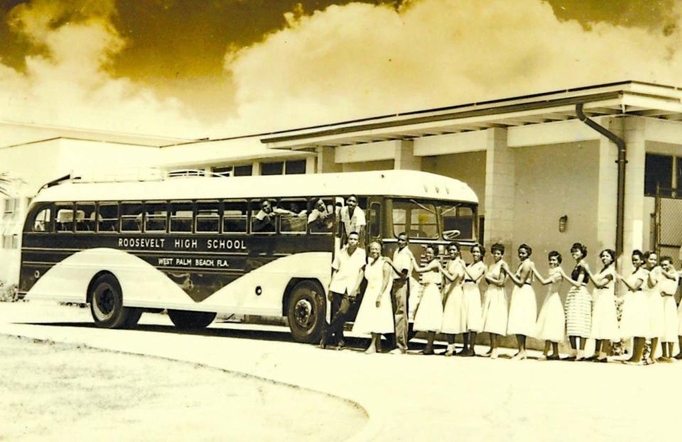 Students in this undated photo waiting to ride the new bus at Roosevelt High School.