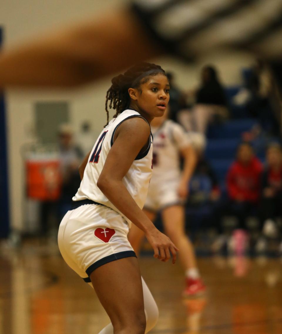 Sacred Heart’s Zakiyah Johnson gets back on defense after scoring the basket against Meade County. Jan. 27, 2023