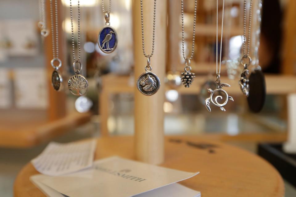 Quarter Moon Imports carries a wide variety of jewelry, clothing and gifts inside the Lake Ella cottage that has been in operation since 1989. Original owner Wendy Halleck is selling the business to her employee Katie Haggerty. 