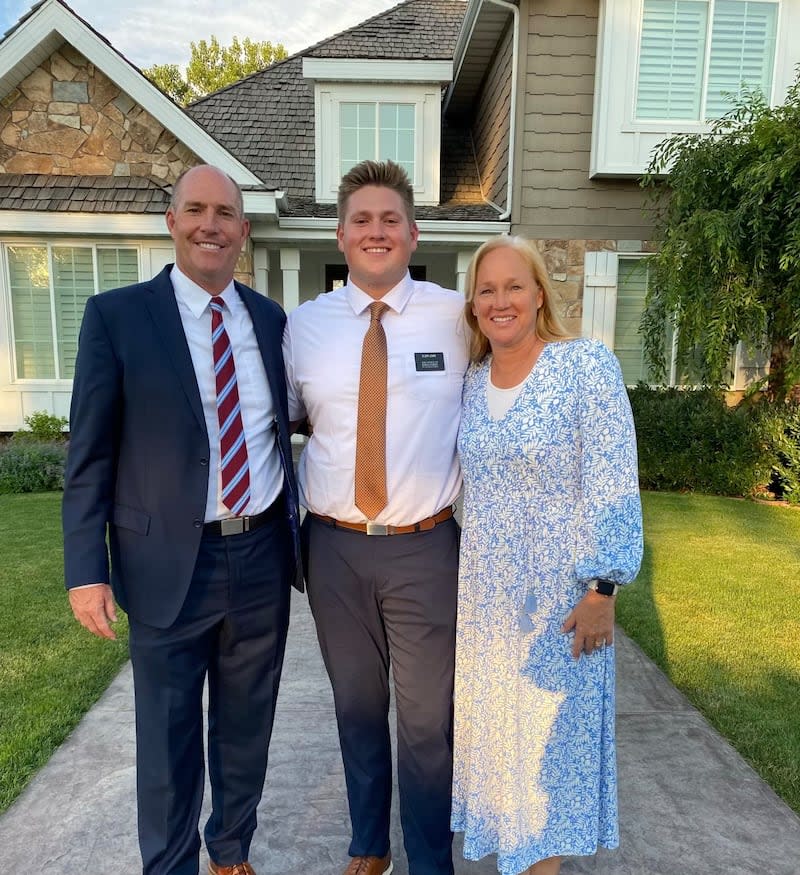 Jeff Lewis, center, poses with his parents, Chad and Michele Lewis, after returning from his Latter-day Saint mission. | Courtesy of Lewis family