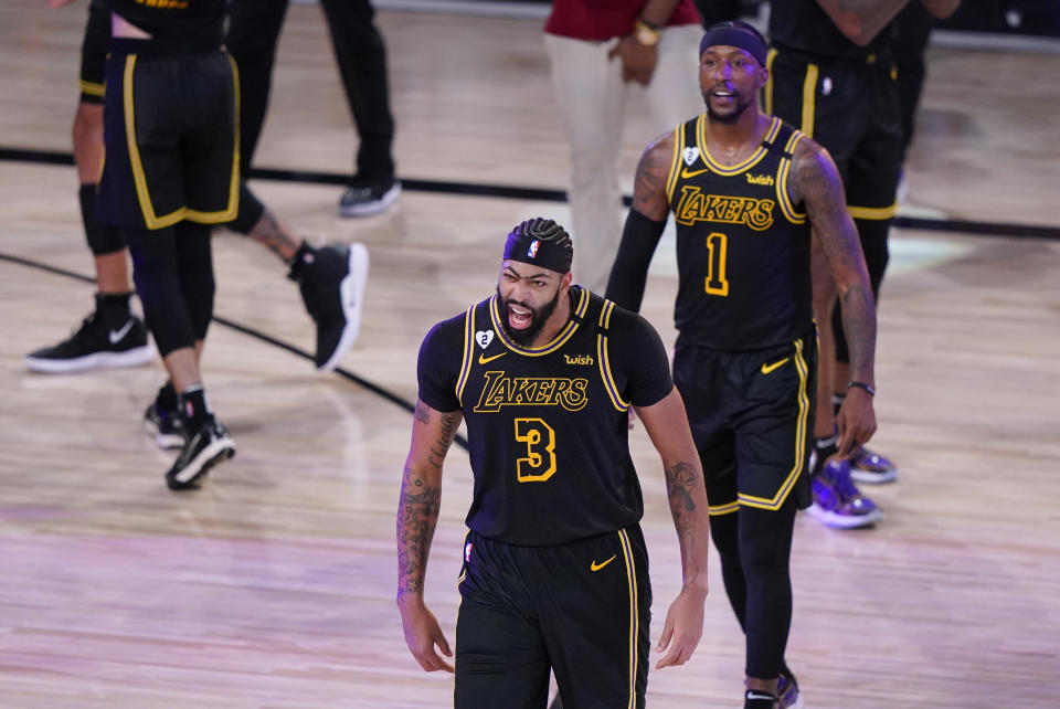 Los Angeles Lakers' Anthony Davis (3) celebrates after an NBA conference final playoff basketball game against the Denver Nuggets Sunday, Sept. 20, 2020, in Lake Buena Vista, Fla. The Lakers won 105-103. (AP Photo/Mark J. Terrill)