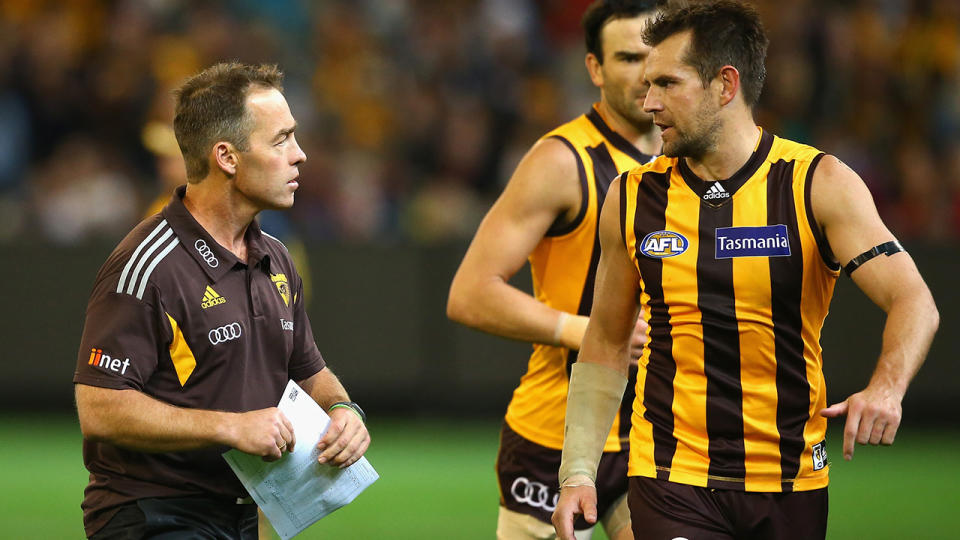 Hawthorn coach Alastair Clarkson speaks with Luke Hodge during a match in 2016.