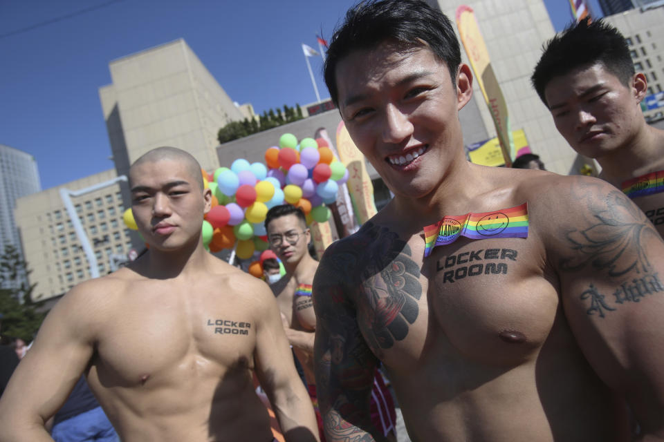 Participants march through a street during a pride parade in Taipei, Taiwan, Saturday, Oct. 31, 2020. (AP Photo/Chiang Ying-ying)