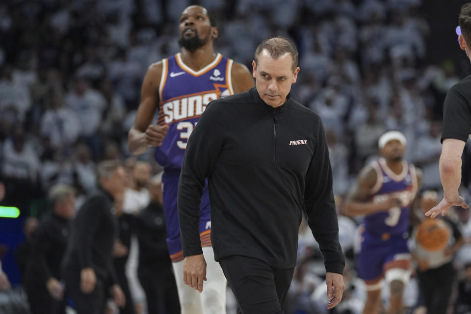 Phoenix Suns head coach Frank Vogel stands on the court after calling a timeout during the first half of Game 1 of an NBA basketball first-round playoff series against the Minnesota Timberwolves, Saturday, April 20, 2024, in Minneapolis. (AP Photo/Abbie Parr)