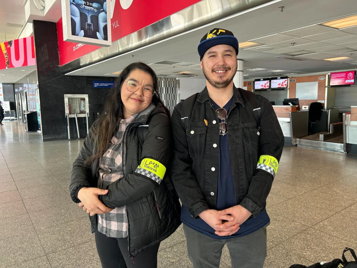 Kautjak Qaunnaaluk, left, and Moses Aronsen, right, are both front-line workers at Makivvik's Reaching Home and Urban Inuit. They meet Inuit patients arriving at Montreal's Trudeau International Airport. (Sara Eldabaa/CBC - image credit)