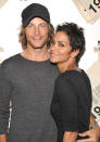 <p>Berry met Canadian model Gabriel Aubry in November 2005 when they shot a Versace ad campaign together. Like all Berry’s relationships, it moved quickly. The pair stepped out publicly together three months later, and Aubry’s father <a rel="nofollow noopener" href="http://www.people.com/people/article/0,,1159802,00.html" target="_blank" data-ylk="slk:blabbed to the media;elm:context_link;itc:0;sec:content-canvas" class="link ">blabbed to the media</a> that his son had confessed he was already in love. When Berry spoke to Oprah Winfrey in October 2007, she explained exactly what she loved about her new man. “He’s always his authentic self, never worried about being judged,” she said. “To walk with that kind of confidence — and with integrity, I know he has ability to love me, love our children, and he will do that.” (Photo: John Shearer/Getty Images for Gap) </p>