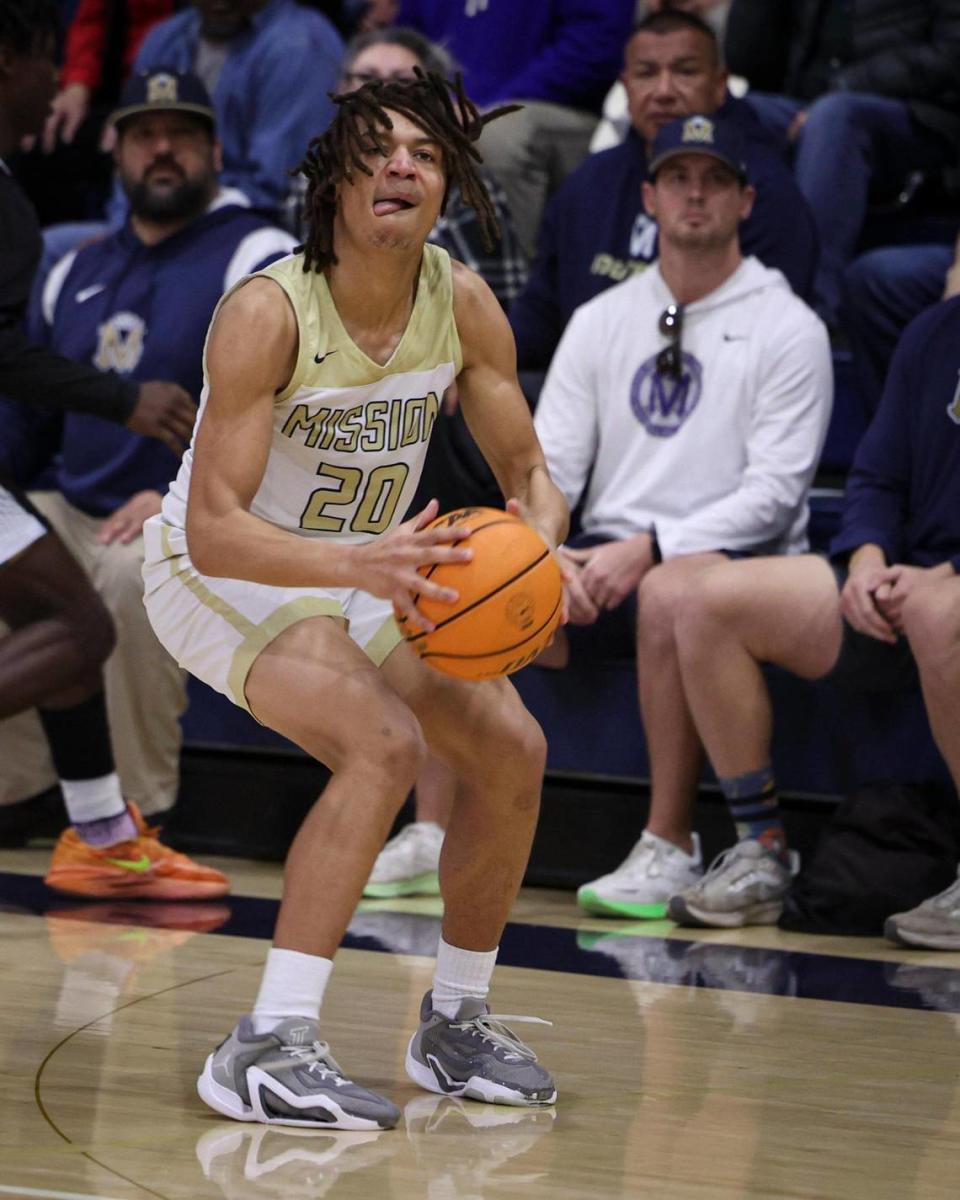 Jayden Nozil oulls up for a three point shot. Mission Prep overcame a first half deficit to finish with a win over Hoover of Fresno, 67-56 in a high school basketball playoff Feb. 20, 2024.