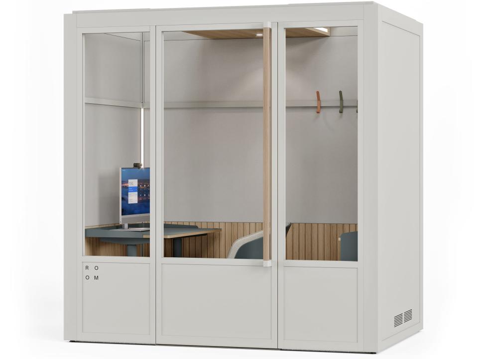 a rendering of a Room for Zoom booth with a white frame with a chair, desk, desktop