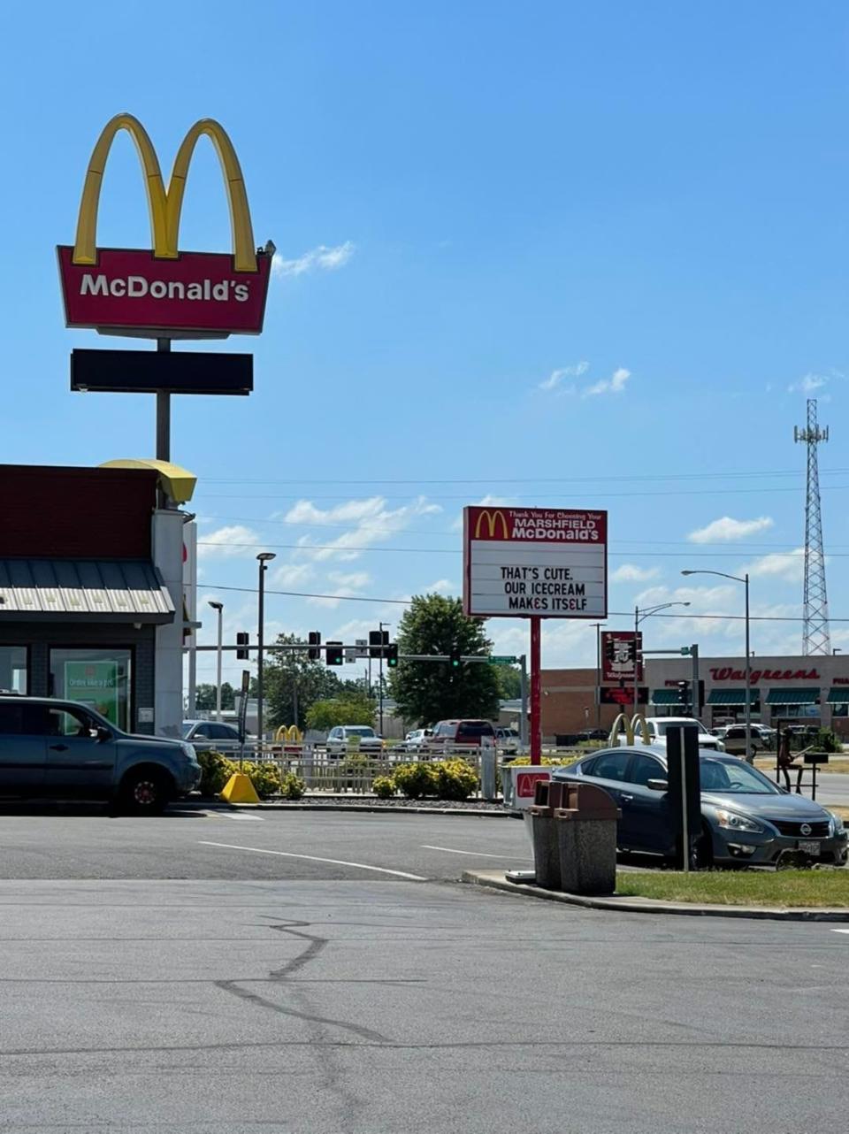 a McDonald's sign that says "that's cute, our ice cream makes itself"