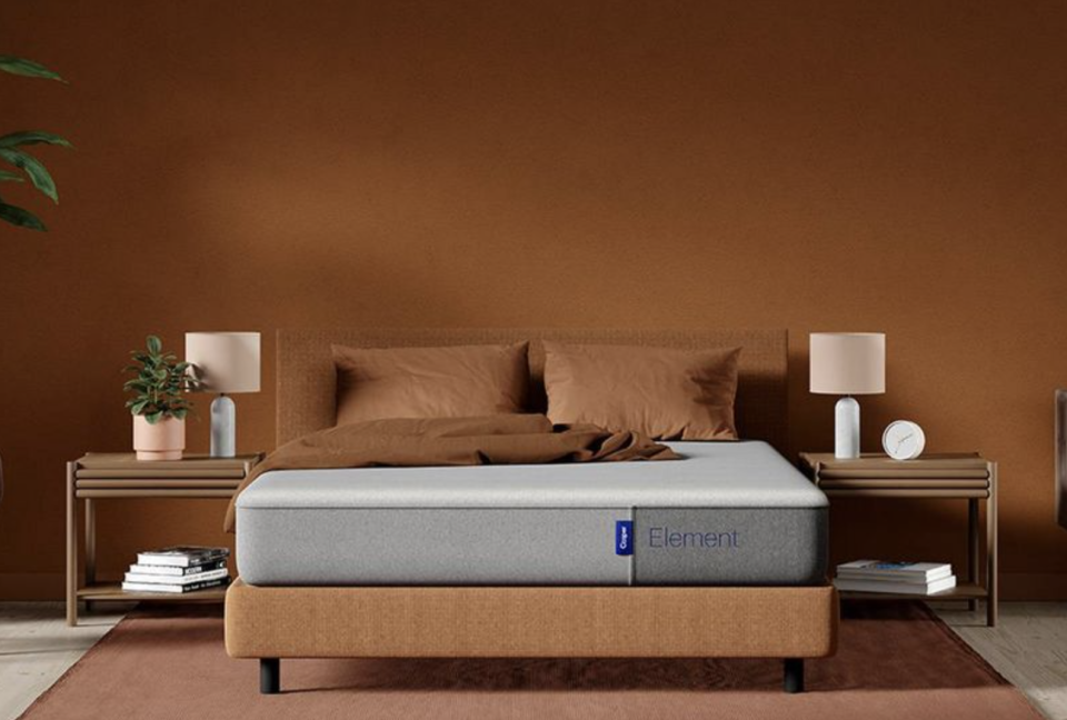 the mattress on a brown platform bed