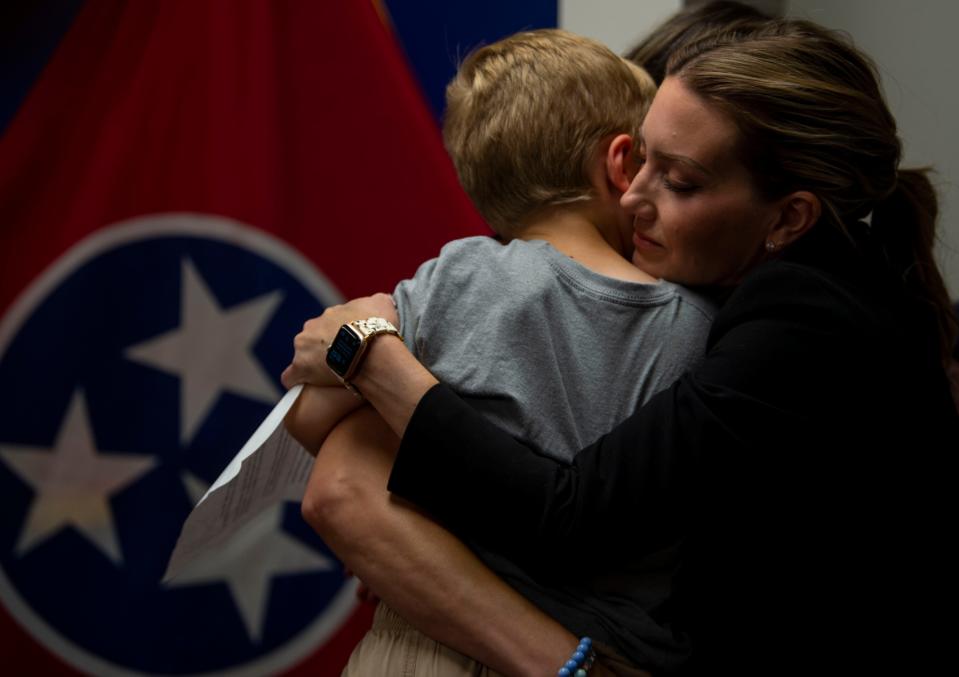 Melissa Alexander, a Covenant School parent and co-founder of Covenant Families for Brighter Tomorrows embraces, fellow cofounder and parent of a Covenant student, Sarah Shoop Neumann, and her son Noah, after Shoop Neumann spoke during a press conference for Covenant Families for Brighter Tomorrows, at Cordell Hull State Office Building in Nashville , Tenn., Wednesday, July 19, 2023.
