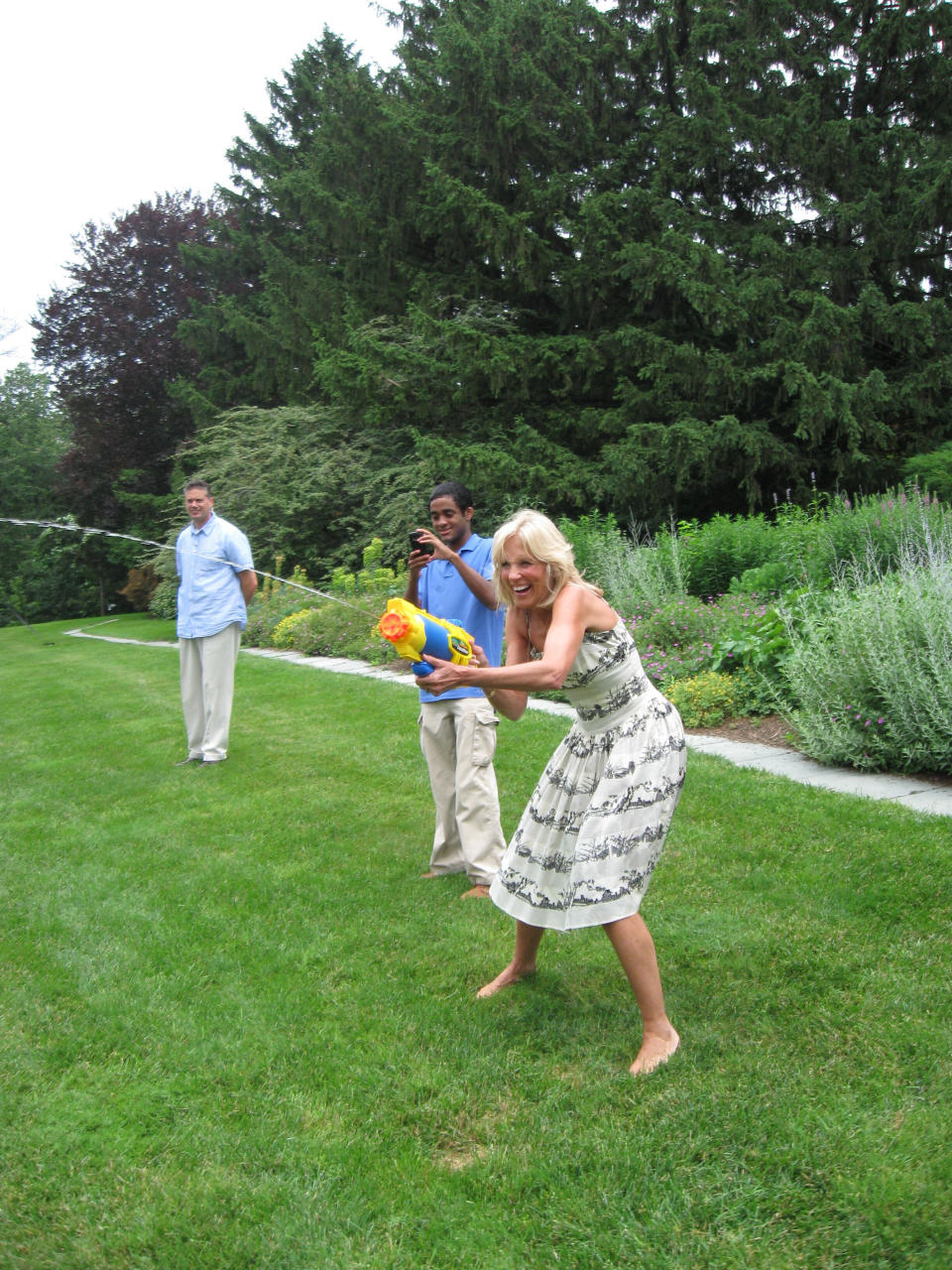 Jill Biden participates in a Super Soaker battle at the event. 