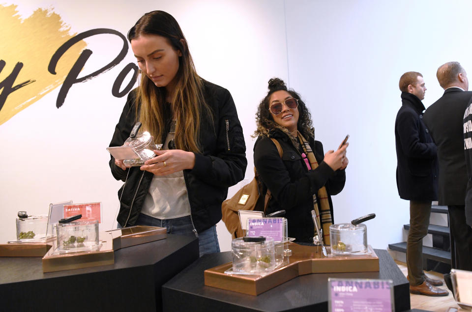 Customers and staff at the Hunny Pot Cannabis Co. retail cannabis store shop as marijuana retail sales commenced in the province of Ontario, in Toronto, Ontario, Canada April 1, 2019.  REUTERS/Moe Doiron