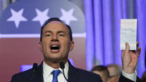 Utah Republican Sen. Mike Lee holds his pocket Constitution as he speaks to supporters during an election night party Tuesday, Nov. 8, 2022, in Salt Lake City. (AP Photo/Rick Bowmer)
