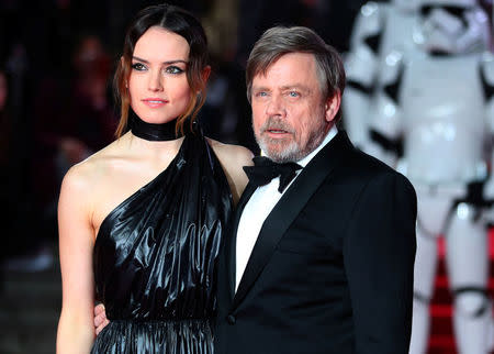Actors Daisy Ridley and Mark Hamill pose for photographers as they arrive for the European Premiere of 'Star Wars: The Last Jedi', at the Royal Albert Hall in central London, Britain December 12, 2017. REUTERS/Hannah McKay