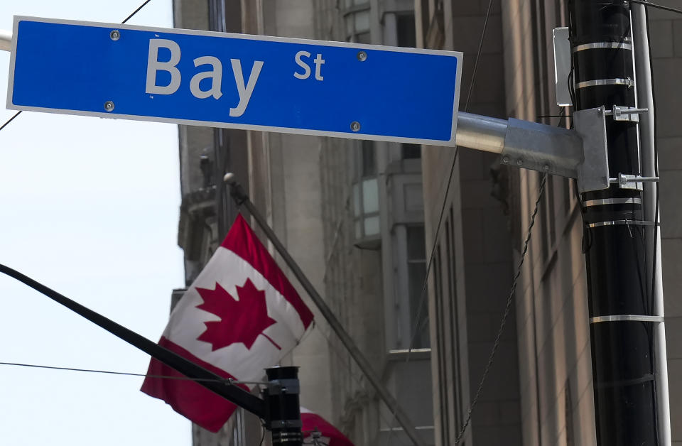 The Bay Street Financial District is shown with the Canadian flag in Toronto on Friday, August 5, 2022. THE CANADIAN PRESS/Nathan Denette