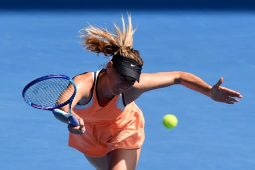 Down and out: Sharapova suffered an 18th straight loss to Williams, before serving a 15-month doping ban