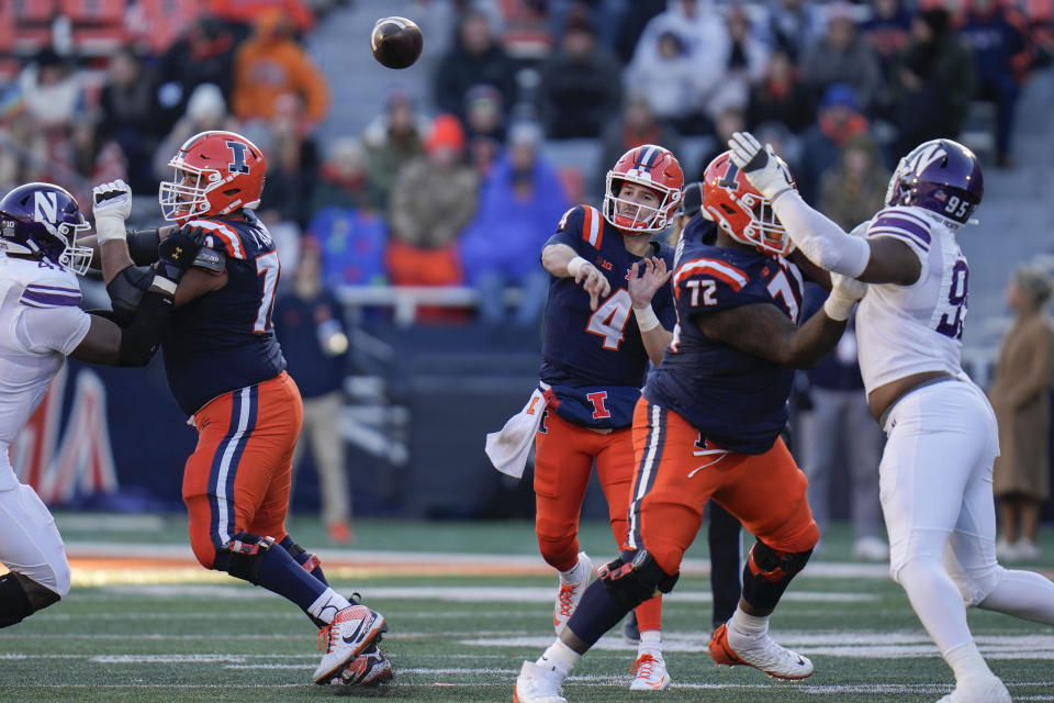 Illinois quarterback John Paddock (4) throws a pass during the first half of an NCAA college football game against Northwestern, Saturday, Nov. 25, 2023, in Champaign, Ill. (AP Photo/Erin Hooley)