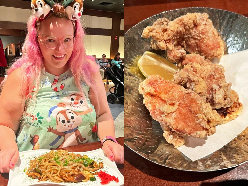 Author sits in front of plate of udon noodles, chicken karaage with a slice of lemon on a plate