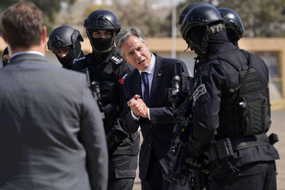 FILE - Secretary of State Antony Blinken thanks the members of Jordan special forces upon his departure from the airport, in Amman, Jordan, Oct. 13, 2023, en route to Qatar. AP Washington photographer Jacquelyn Martin recalls how being one of a few female photographers covering news and politics was useful when she was assigned as the press pooler for Blinken's last-minute trip to Israel and the Middle East in the aftermath of the Hamas attacks. Martin said, “Sometimes people not knowing what to make of you works in your favor.” (AP Photo/Jacquelyn Martin, Pool, File)