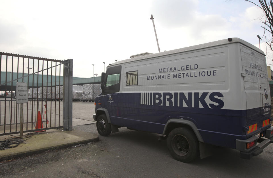 FILE- An armored truck of Brinks Diamond and Jewelry Services arrives at the cargo section of Brussels international airport, on Feb. 19, 2013. A decade after a brazen diamond heist at Brussels airport, it looks like a near-perfect crime. While one person was convicted to five years in prison and a small part of the loot — estimated at $50 million in 2013 — was recovered, the four remaining suspects were acquitted on appeal Wednesday March 8, 2023, leaving it unclear whether the mastermind will ever be found. (AP Photo/Yves Logghe, File)