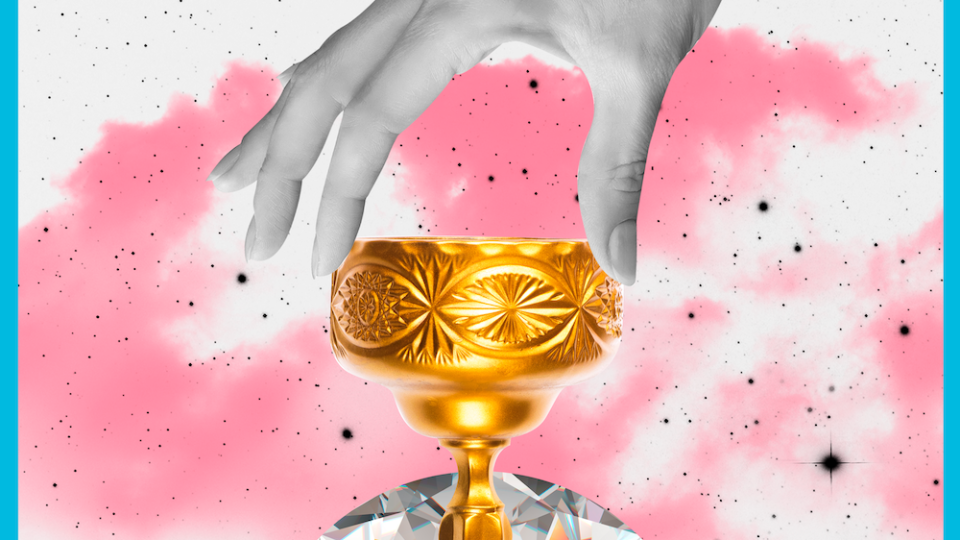 the tarot card the knight of cups, showing a hand holding a golden goblet