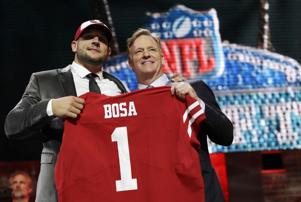 Ohio State defensive end Nick Bosa poses with NFL commissioner Roger Goodell after the San Francisco 49ers selected Bosa in the first round at the NFL football draft. (AP)