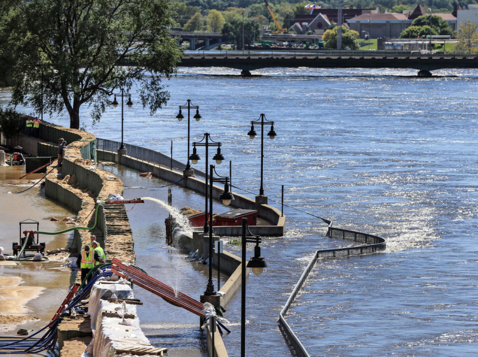 <p>Emergency crews monitor the flood barriers along the Cedar River in Downtown Cedar Rapids, Iowa, Tuesday, Sept. 27, 2016. (Zach Boyden-Holmes/The Register via AP)</p>