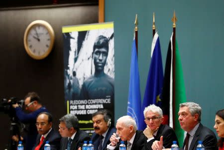 Filippo Grandi, High Commissioner for Refugees (R) addresses next to Mark Lowcock, Under-Secretary-General for Humanitarian Affairs and Emergency Relief Coordinator (OCHA) and William Lacy Swing, Director General of the International Organisation for Migration (IOM) during the Pledging Conference for Rohingya Refugee Crisis in Bangladesh at the United Nations in Geneva, Switzerland October 23, 2017. REUTERS/Denis Balibouse