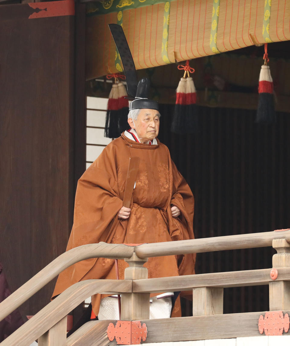 Japan's Emperor Akihito leaves after a ritual to report his abdication to the throne, at the Imperial Palace in Tokyo, Tuesday, April 30, 2019. Akihito announced his abdication at a palace ceremony Tuesday in his final address, as the nation embraced the end of his reign with reminiscence and hope for a new era. (Japan Pool via AP)
