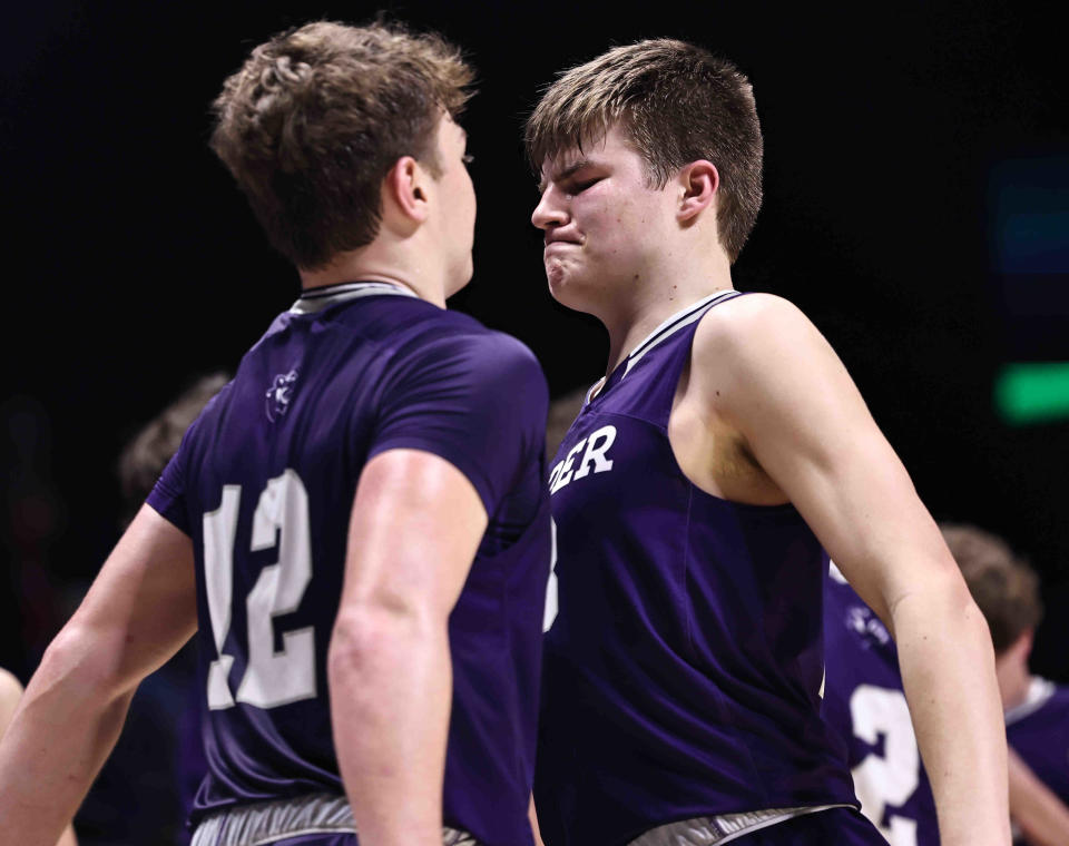 Elder players Tyler Johnson (33) and Ryan Brass celebrate after the Panthers' district final win over Wayne Sunday, March 10, 2024.