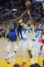 Golden State Warriors forward Draymond Green (23) shoots against Dallas Mavericks center Daniel Gafford (21) during the second half of an NBA basketball game in San Francisco, Tuesday, April 2, 2024. (AP Photo/Jeff Chiu)