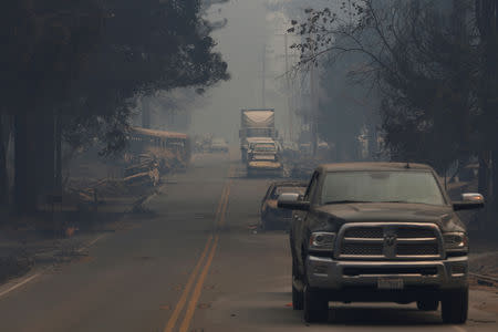 Abandoned vehicles are seen along Skyway during the Camp Fire in Paradise, California, U.S. November 9, 2018. REUTERS/Stephen Lam