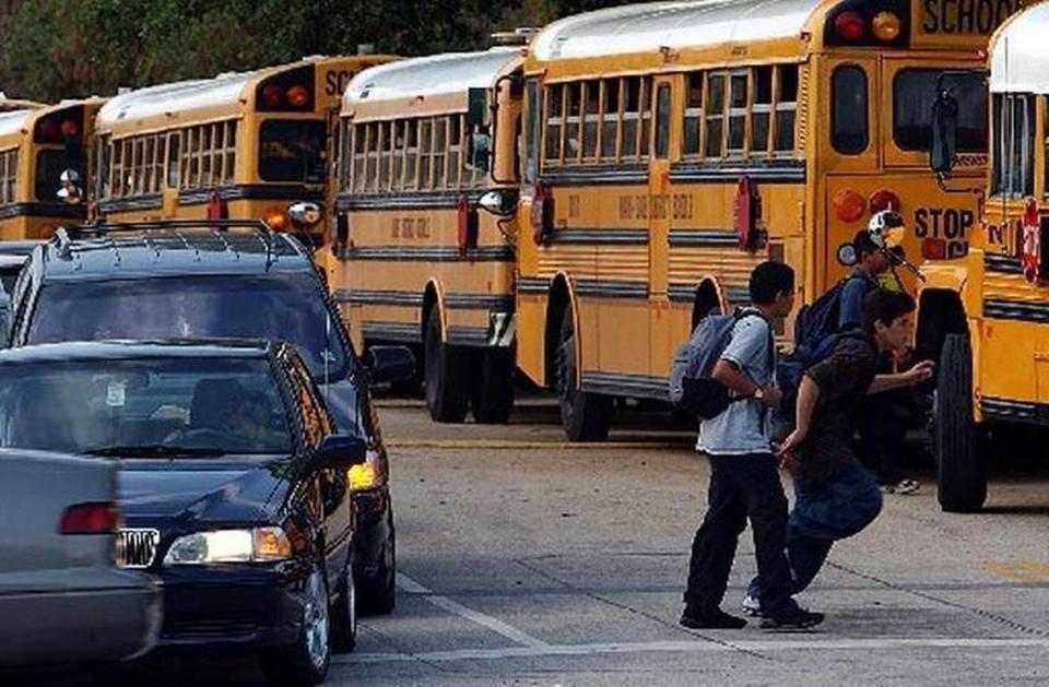 Drivers, kids and school buses, seen here in a file photo from 2018, will be fixtures on South Florida roadways as schools are in session for the 2019-20 year in Miami-Dade and Broward counties as of Aug. 19, 2019.