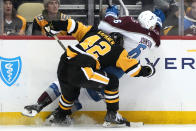 Pittsburgh Penguins' Kasperi Kapanen (42) collides with Colorado Avalanche's Erik Johnson during the second period of an NHL hockey game in Pittsburgh, Tuesday, Feb. 7, 2023. (AP Photo/Gene J. Puskar)