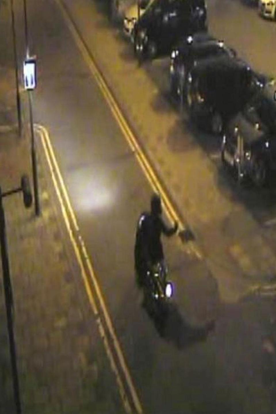 A CCTV still showing the moped riding away. (Met Police)
