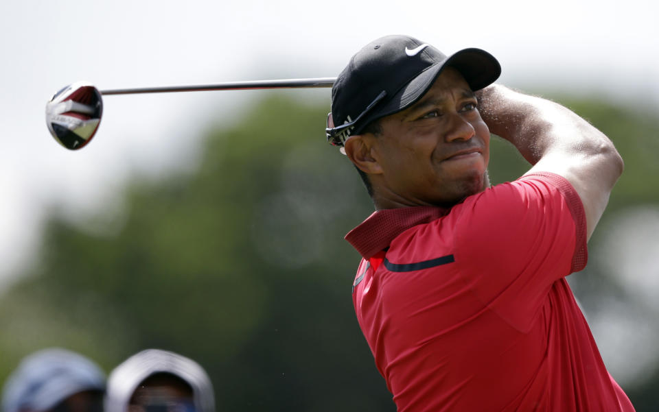 Tiger Woods hits from the third tee during the final round of the Cadillac Championship golf tournament on Sunday, March 9, 2014, in Doral, Fla. (AP Photo/Wilfredo Lee)