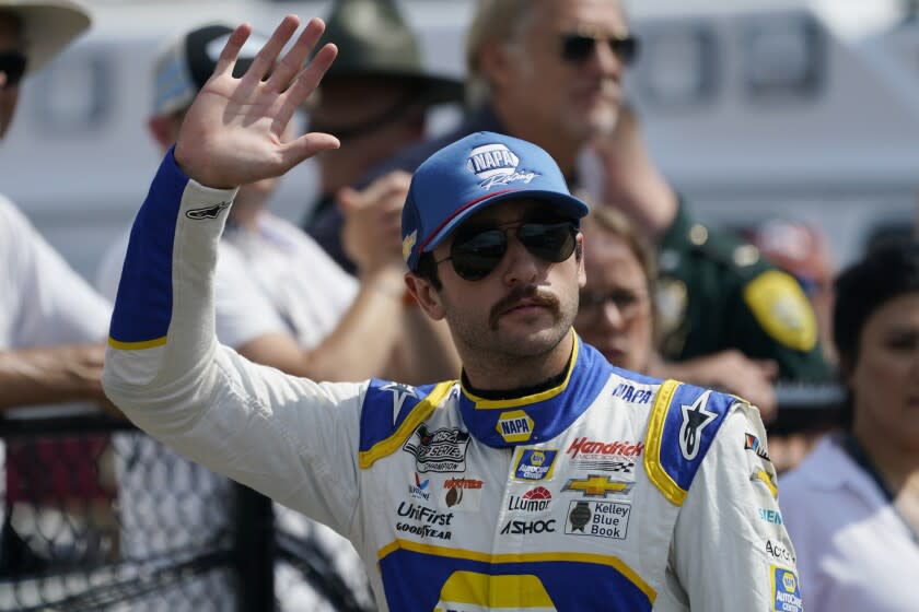 NASCAR Cup Series driver Chase Elliott waves prior to the NASCAR Cup Series.