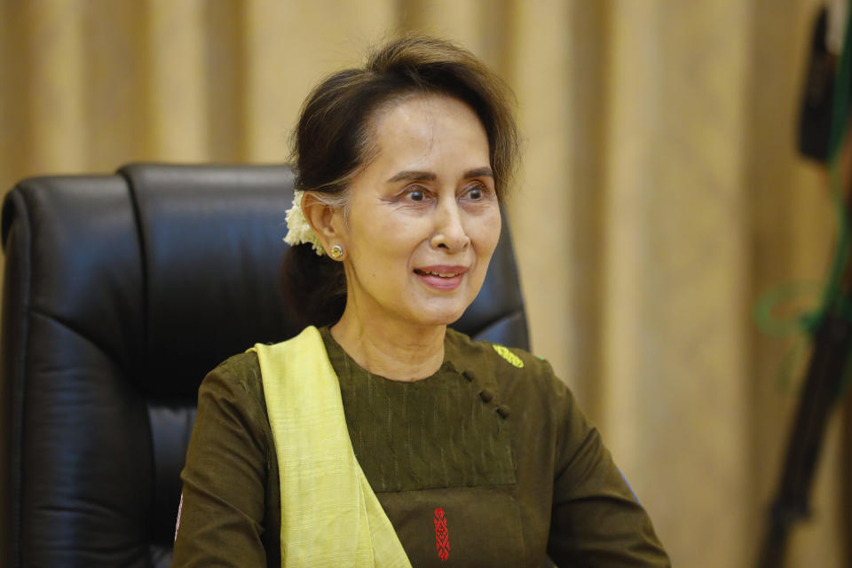 In this handout image provided by the Myanmar State Counsellor Office, Myanmar leader Aung San Suu Kyi is shown while she attends a video conference, Friday, July 3, 2020, in Naypyitaw, Myanmar. Suu Kyi expressed sadness Friday over a landslide at a jade mining site in the country's north that took over 100 lives, blaming the tragedy on joblessness. (Myanmar State Counsellor Office via AP)